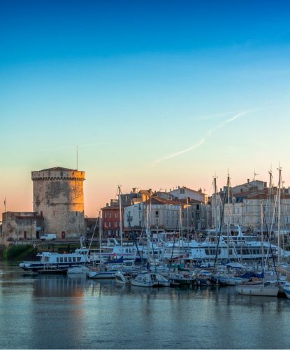 panorama-of-the-old-harbor-of-la-rochelle-france-at-sunset-picture-id1156461621